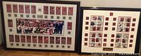 Two framed plaques showing Team Canada 2002 and 2010 Olympic hockey teams certificates, cards, and coins laid against a wall