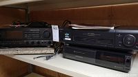 Wide angle photo showing Sony STR-GX57ES receiver alongside Sony SLV-960HF VHS player and Hitachi F330 VHS player on shelf.