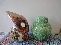 Photo of both items side-by-side on floral tablecloth, showing shapes and exterior designs.