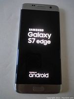Samsung Galaxy S7 Edge smartphone showing the Samsung Galaxy S7 Edge startup screen and Android powered logo.