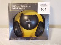 Sealed front packaging showing headphones and transmitter inside.