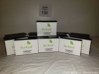 Photo showing 20 bars of Bee Kind Cleansing Soap arranged in two rows with clear Bee Kind branding on the boxes.