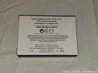 Back packaging detail of Bee Kind Cleansing Soap listing ingredients and product info.