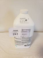 Front view of the one gallon CIDEX OPA Solution jug showing product and safety label with maxsold lot number 241.