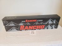 Black Rancho branded box with mountain graphics containing the shock absorbers.