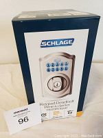 Front view of the Schlage keypad electronic deadbolt box, showing the keypad and brand name.