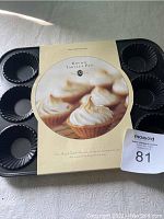 Top view of packaged Williams Sonoma Round Tartlet Pan in original box with label showing 12 cups and a tartlet photo.