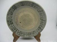 Front view of the antique Chinese pottery plate showing decorative border and sized around 9 5/8 inches