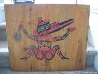 Front view of the indigenous painting on plywood, showing full stylized figure and wood grain