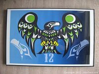 Full view of framed limited edition Seattle Seahawks 12 Man print with stylized eagle and number 12.