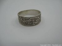 Front view of vintage sterling silver ring with indigenous engraving.