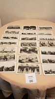 Full layout of 21 stereoscope cards arranged on table, showing various World War I scenes.
