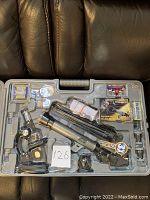 Full view of the deluxe microscope and telescope kit in a molded carrying case, showing the microscope, telescope, and various accessories.