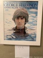 Front cover of the deluxe edition box featuring George Harrison's portrait in water.