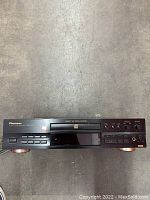 Pioneer PDR-609 compact disc recorder front view showing CD tray, control buttons, digital display, and branding.