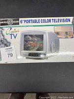 Box of 6 inch portable color television showing product branding and image