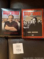 Front covers of The Sopranos Seasons 1 and 2 DVD box sets showing main cast images and titles.