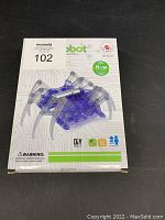 Front view of new sealed spider robot crawling toy kit in box with plastic intact