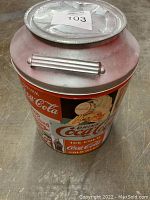 Top view of the vintage Coca Cola designer metal can shaped like an old milk can, showing the removable lid and handle detail.