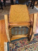 Bottom view of chair showing original springs and wooden rockers