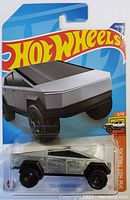 Photo of Hot Wheels Tesla Cybertruck die-cast toy car in original sealed packaging showing front-side of card and toy