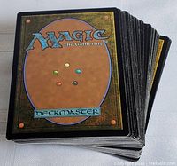 Stack of Magic The Gathering cards showing classic card back design