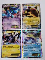 Four Pokemon EX insert cards: Toxicroak EX, Ampharos EX, Zekrom EX, Aurorus EX, all holo foil.