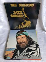 Top view of two vinyl records, Neil Diamond's 'The Jazz Singer' and Willie Nelson's 'Memories On My Mind' albums.