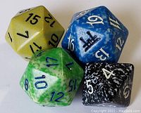 Close-up photo of four multi-sided gaming dice: yellow d20, blue d12, green d20, black d8.