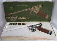 Photo of the original green Match-O-Matic butane gas lighter in foam insert inside box, includes small can of butane gas.