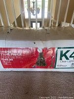 Original box of the 7 1/2 ft pre-lit Christmas tree by Garden Ridge, showing brand and model K4 Clear Lights.