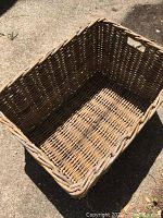 Top-down view showing the deep rectangular shape, woven base, and interior.