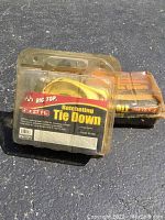 Two packages of Big Top ratcheting tie down straps, each 2 x 27 Ft