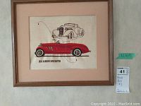 Framed wall art depicting a 1935 Auburn Speedster car illustration and embroidery on fabric with a wooden frame, size approx 12x15 inches.