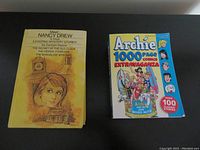 Front view of Nancy Drew 3 Exciting Mystery Stories book and Archie 1000 Page Comics Extravaganza comic book side by side on a flat surface.