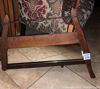 Front view showing entire buck bow cross cut saw frame converted to wall mirror, with visible metal saw blade along bottom and twisted metal brace on top.