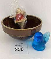 Brown crock bowl with bluebird figurine and Chubby Girl ornament in original plastic