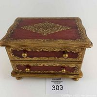 Vintage Florentine style wooden music jewelry box with two drawers, gold painted detailing, photographed from front and top angles.
