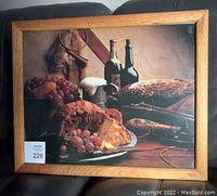 Front view of vintage framed still life picture showing composition and oak wood frame.