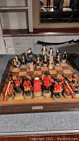 Full view of pressman resin Independence War chess set displayed with all pieces arranged on chessboard, showing piece details and board wear