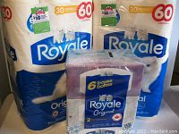 Photo showing two large packages each containing 30 double rolls of Royale Original 2-ply bathroom tissue with white kittens on packaging.