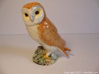 Front view of the Beswick England porcelain barn owl figurine showing detailed painting and glossy finish.