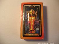 Front view of unopened tarot card deck in sealed wrapper with card art and Easy Gilded Tarot label