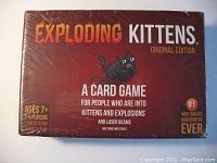 Front view of the sealed Exploding Kittens Original Edition box showing game title, details about players and age, and branding.
