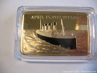Front side of gold plated commemorative bar showing RMS Titanic image and April 15, 1912 inscription.