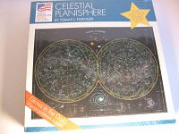 Top of sealed puzzle box showing celestial planisphere image with glow-in-the-dark feature banner and branding details.