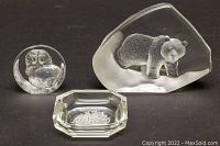 Three clear glass items: bear paperweight, owl paperweight, octagonal etched glass ashtray with sailing ship design