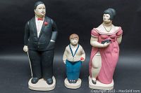 Front view of the three plaster sculptures showing different heights and painted details