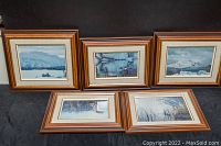 Four framed prints of Robert Bateman artwork showing natural settings and wildlife arranged together