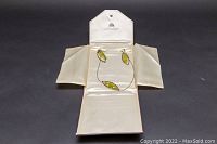 Full set displayed in an off-white presentation box showing necklace and earrings.